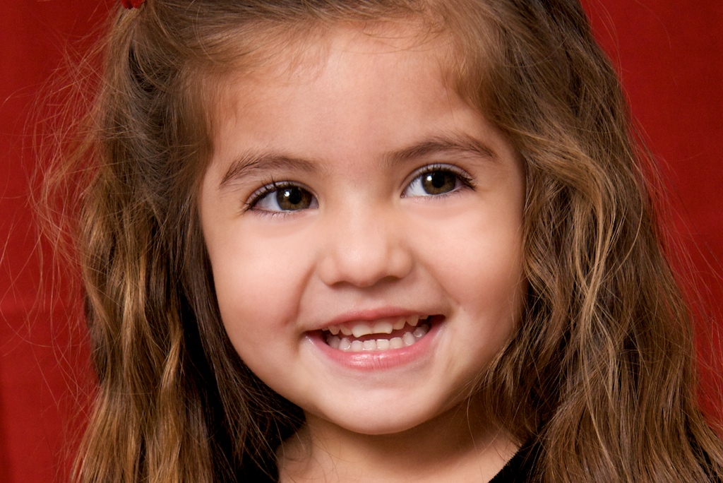 Beautiful little girl with gorgeous smile and beautiful hair!