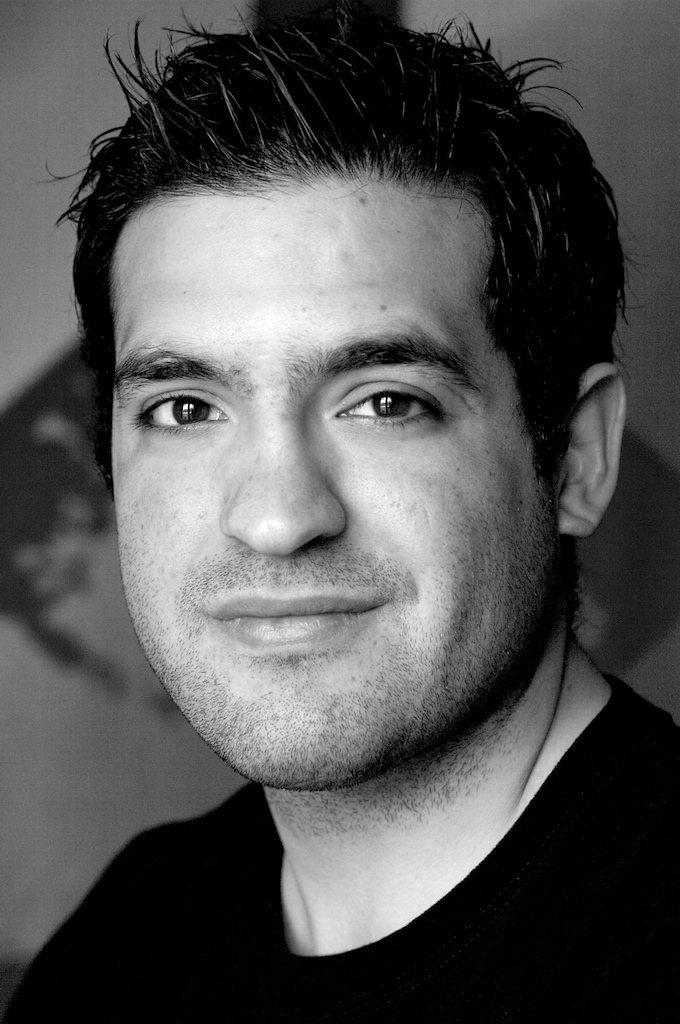 Headshot of handsome young man in black and white