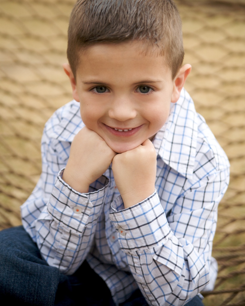 Little Boy's outdoor portrait in hammock